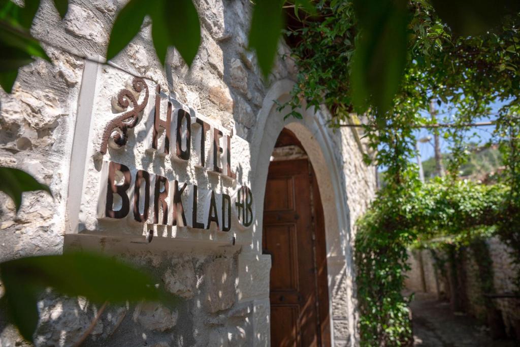 an entrance to a building with a wooden door at Hotel Borklad in Berat