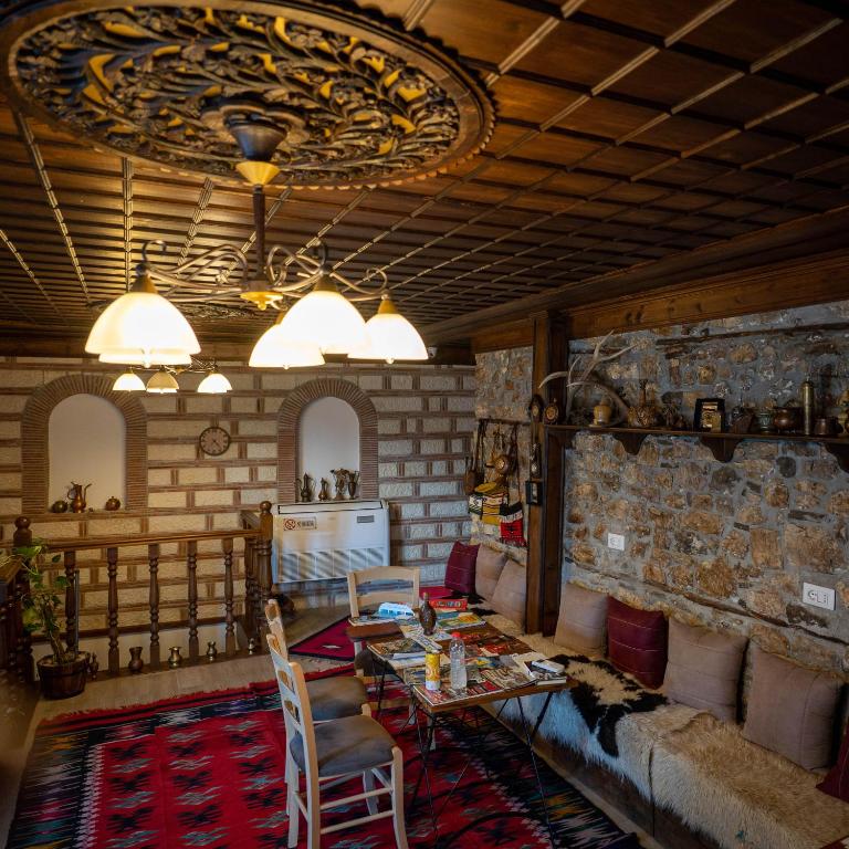 a living room with a couch and a table at Hotel Borklad in Berat