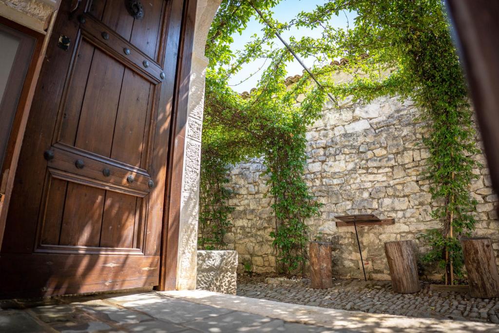 an entrance to a building with a wooden door at Hotel Borklad in Berat