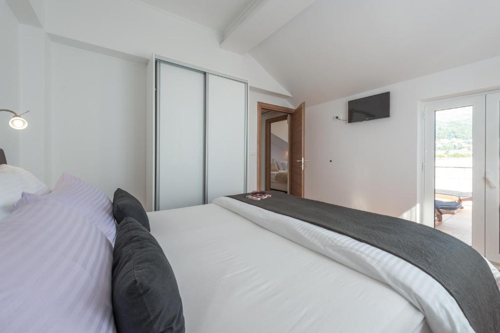 Postel nebo postele na pokoji v ubytování SB Apartment JOY