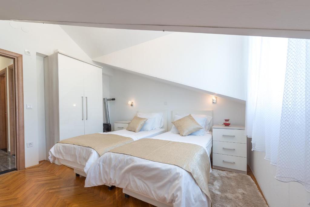 Postel nebo postele na pokoji v ubytování SB Apartment JOY