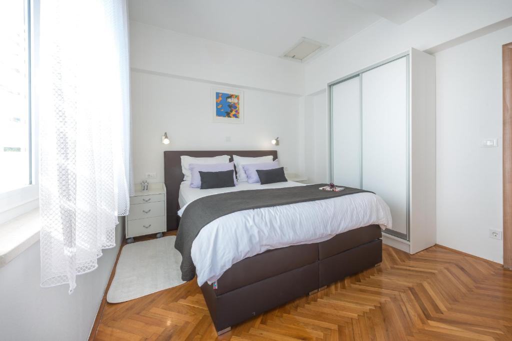Postel nebo postele na pokoji v ubytování SB Apartment JOY