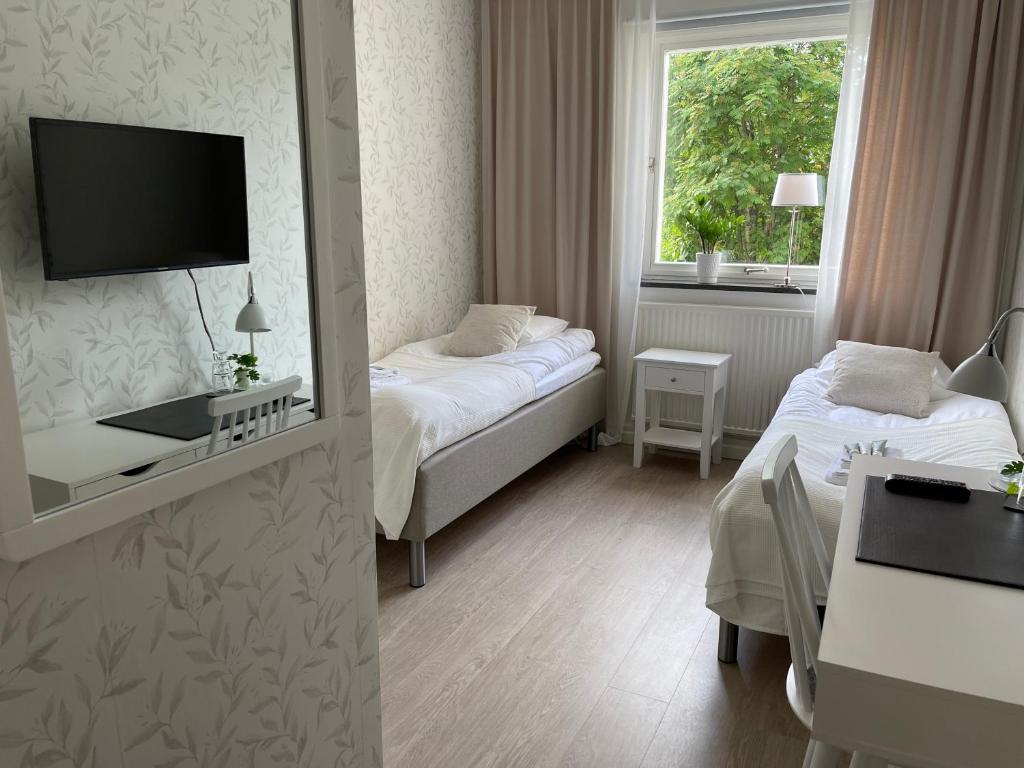 Postel nebo postele na pokoji v ubytování Hotell Luspen