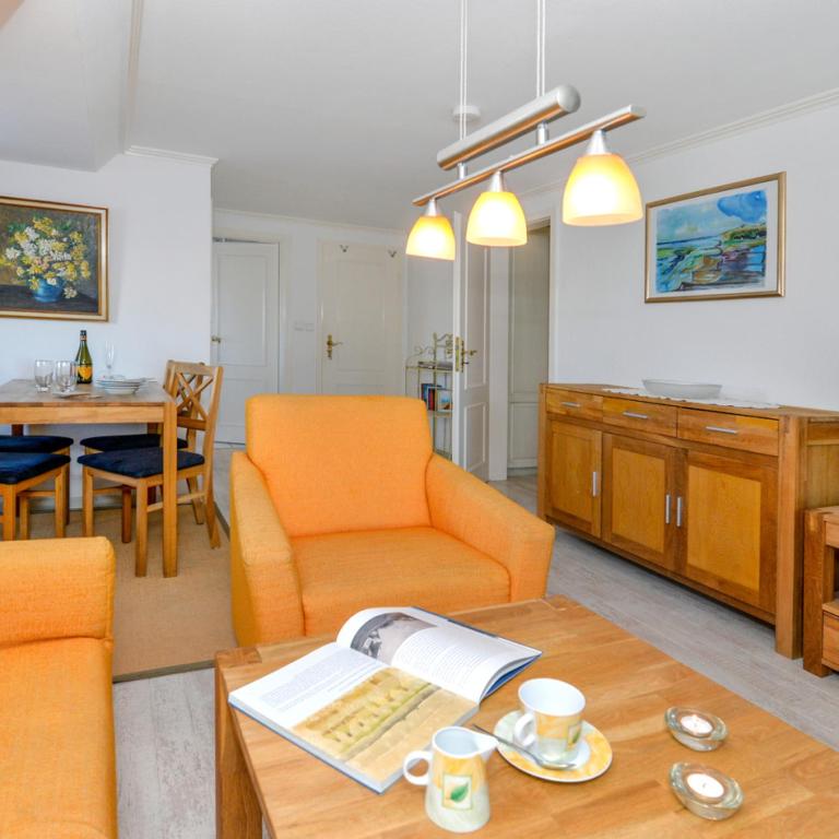 a living room with a couch and a table at Wohnung West in Westerland