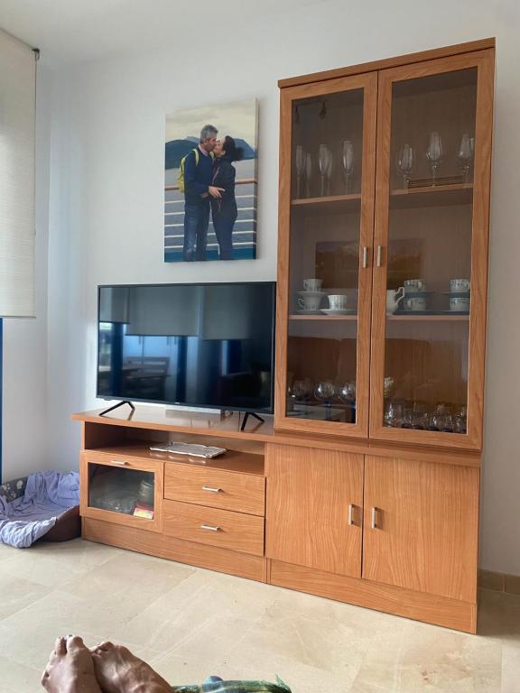 Televízia a/alebo spoločenská miestnosť v ubytovaní Tranquilidad y Relax