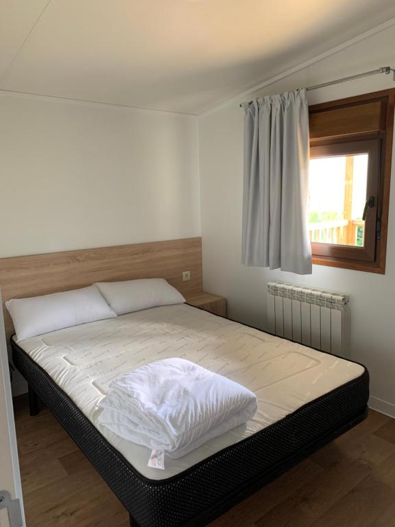 Postel nebo postele na pokoji v ubytování Panticosa Lodge