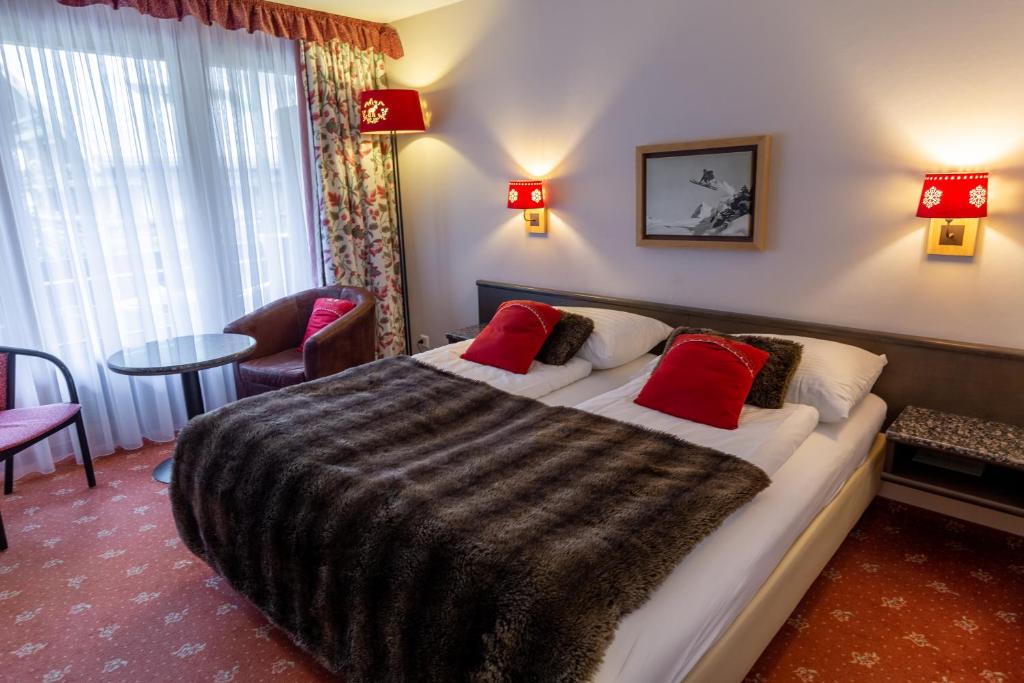 Postel nebo postele na pokoji v ubytování Chalet-Hotel Beau-Site