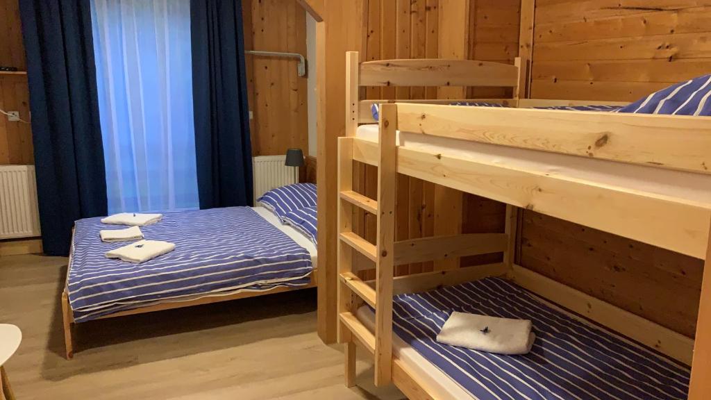 Postel nebo postele na pokoji v ubytování Penzion a Restaurace Vyhlídka