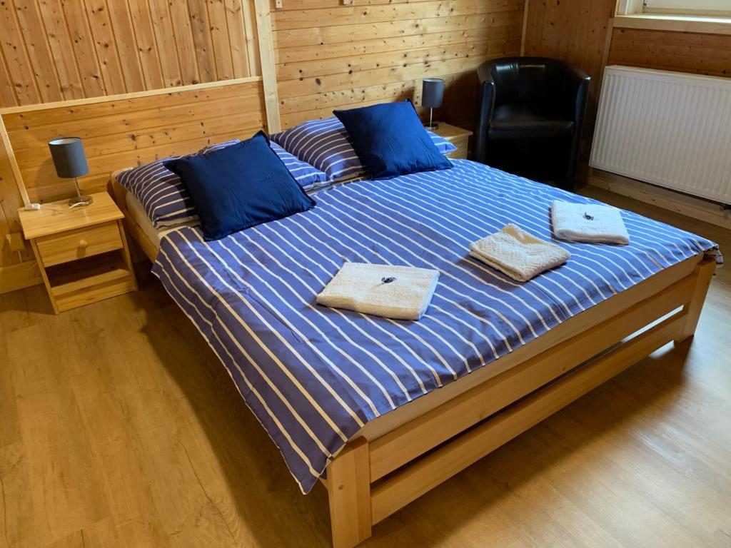 Postel nebo postele na pokoji v ubytování Penzion a Restaurace Vyhlídka