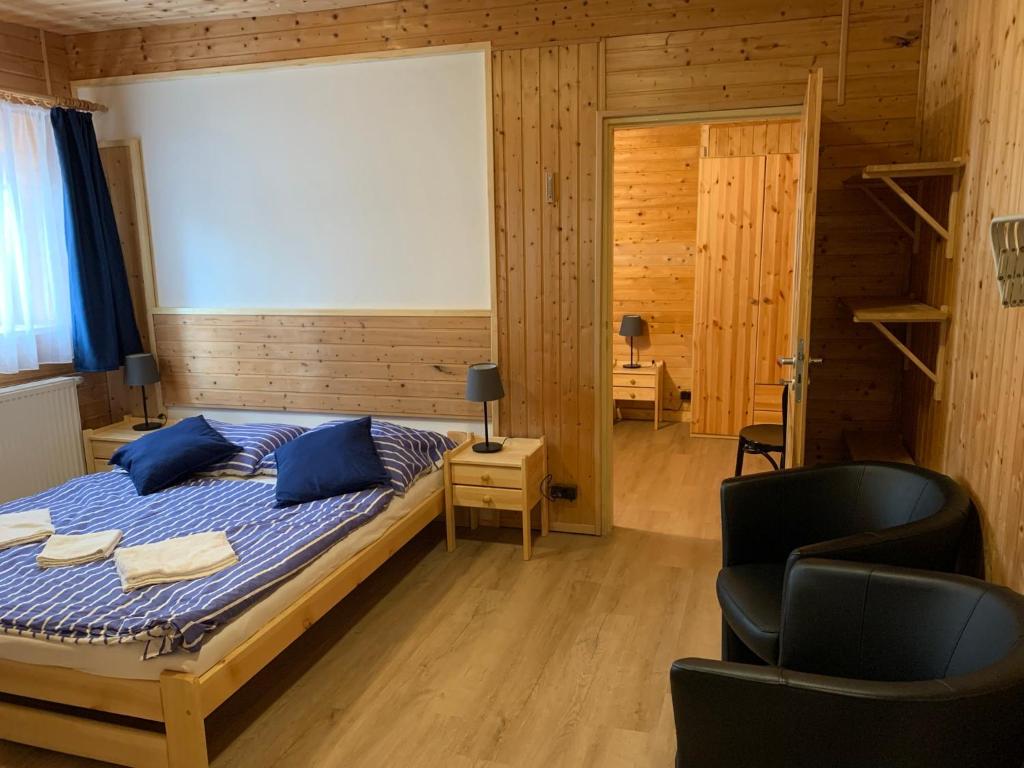 Postel nebo postele na pokoji v ubytování Penzion a Restaurace Vyhlídka