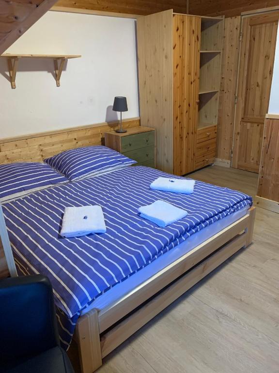 Postel nebo postele na pokoji v ubytování Penzion a Restaurace Vyhlídka