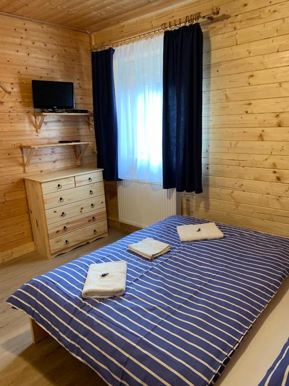Postel nebo postele na pokoji v ubytování Penzion a Restaurace Vyhlídka