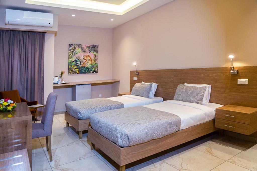 Postel nebo postele na pokoji v ubytování HOTEL ASTRAL