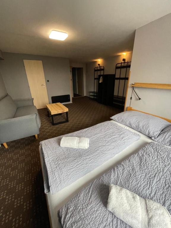 Postel nebo postele na pokoji v ubytování Apartments Maxi