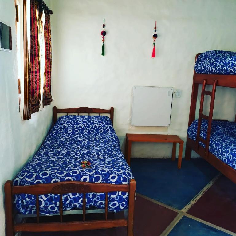 Postel nebo postele na pokoji v ubytování Cabañitas EL REPOSO HUMAHUACA