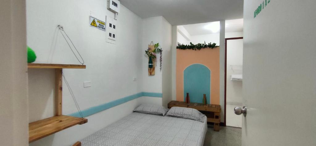 Postel nebo postele na pokoji v ubytování Hostal paz y vida