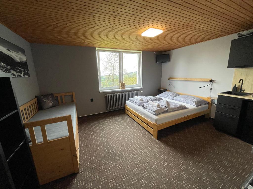 Postel nebo postele na pokoji v ubytování Apartments Maxi