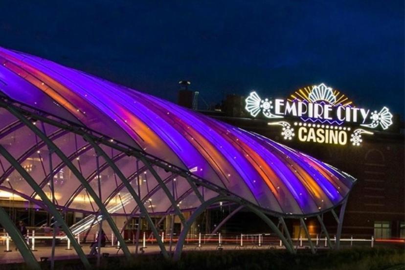 a building with a lit up sign in front of it at Nice Cozy Room By Empire City Casino And Cross County Mall in Yonkers
