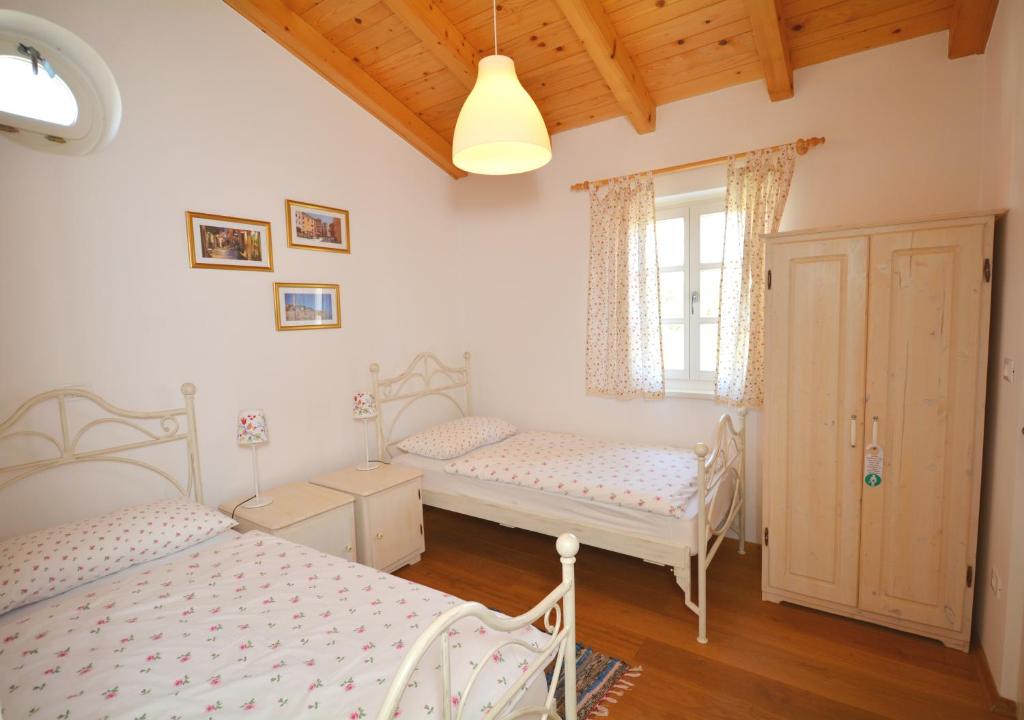 Postel nebo postele na pokoji v ubytování Villa Petra