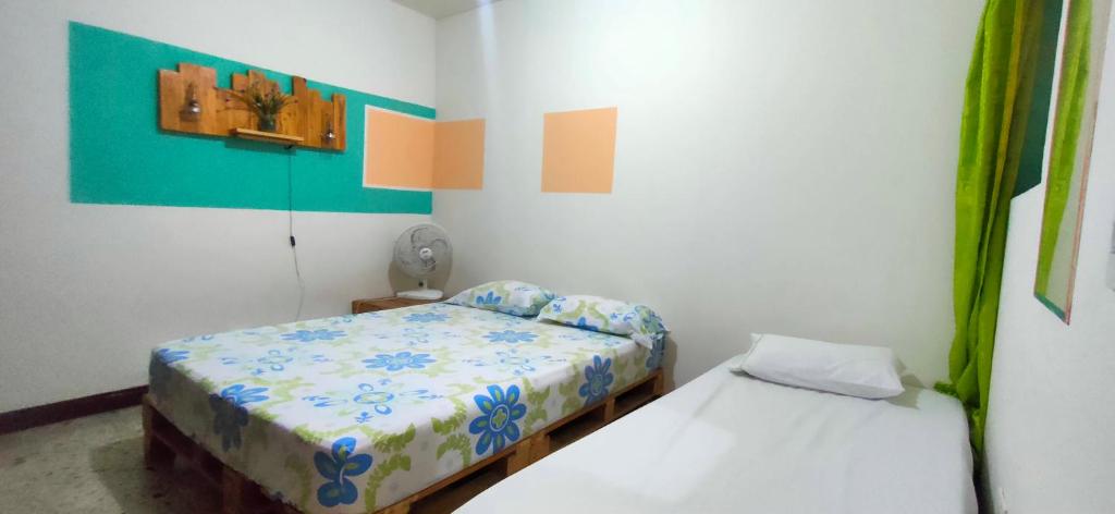 Postel nebo postele na pokoji v ubytování Hostal paz y vida