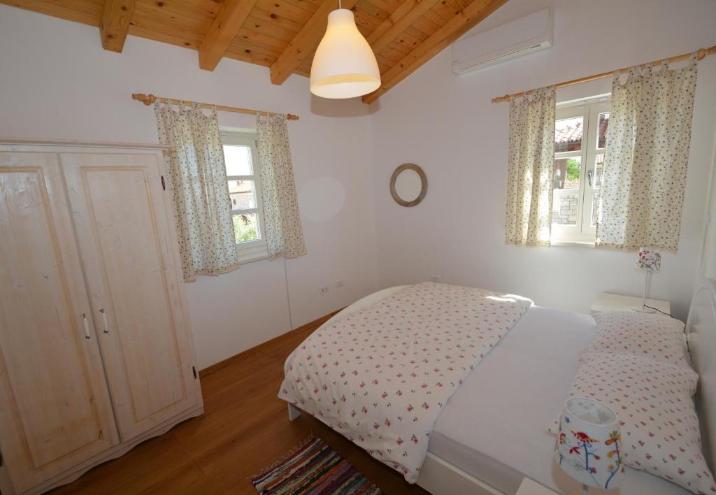 Postel nebo postele na pokoji v ubytování Villa Petra
