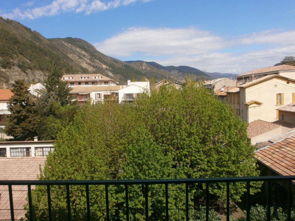a view of a city from a balcony at Joli Studio centre ville Digne les Bains Galion 80 in Digne-les-Bains