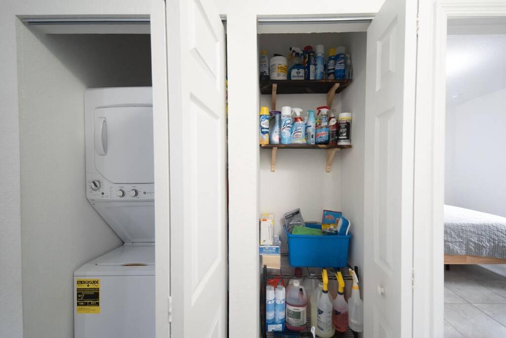 a kitchen with a pantry with a washer and dryer at New house on the block near Miami Airport. in Miami