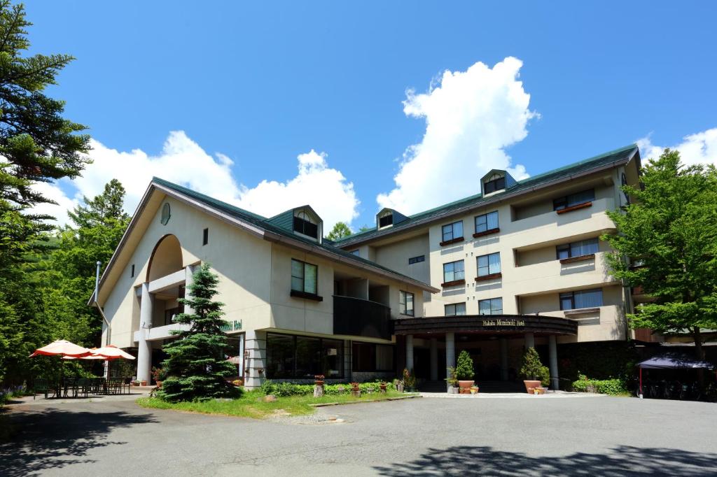 una representación de la parte delantera de un hotel en Hakuba Mominoki Hotel en Hakuba