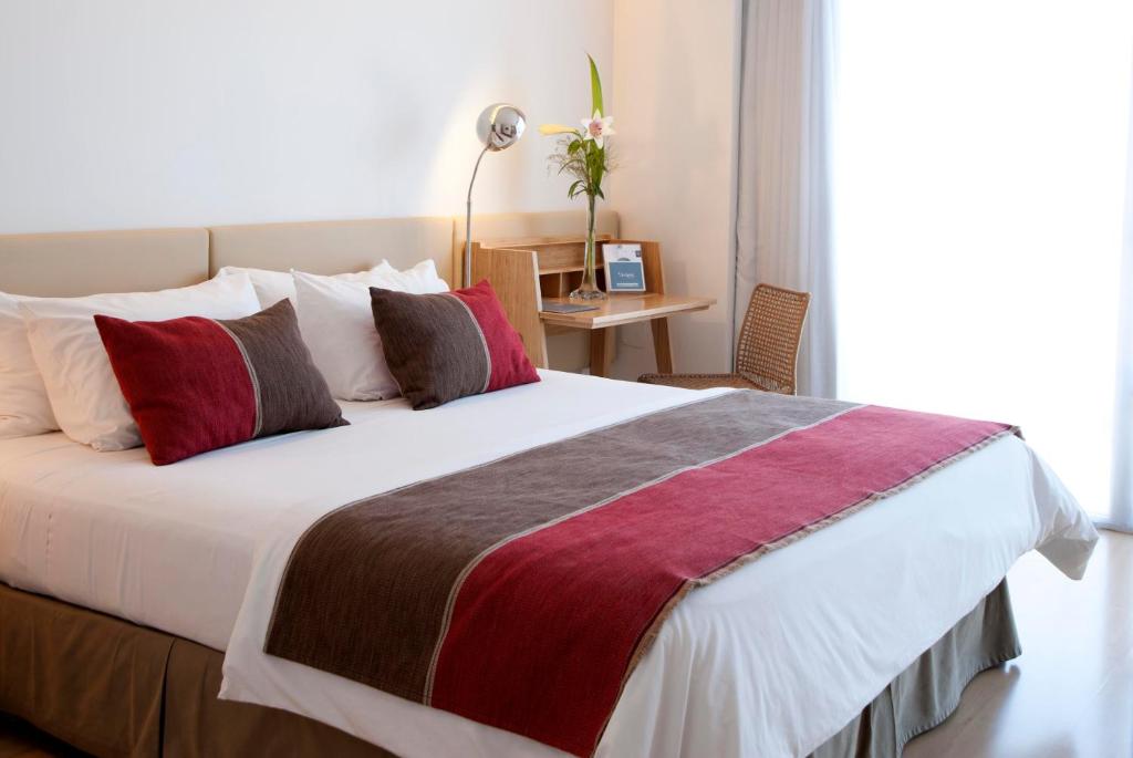 Кровать или кровати в номере Design Apart