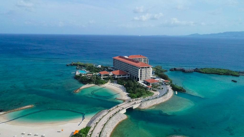 an aerial view of a hotel on a island in the ocean at Hyatt Regency Seragaki Island Okinawa in Onna