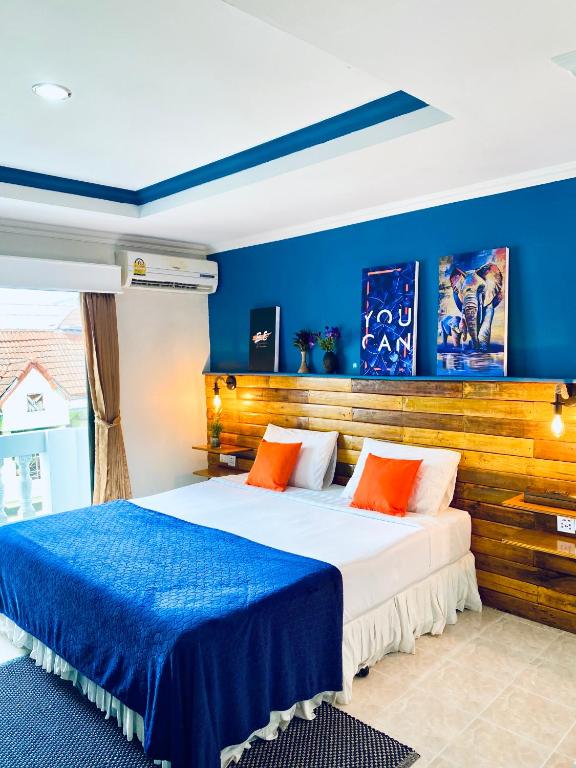 Postel nebo postele na pokoji v ubytování BH Baan Paradise Hotel Patong