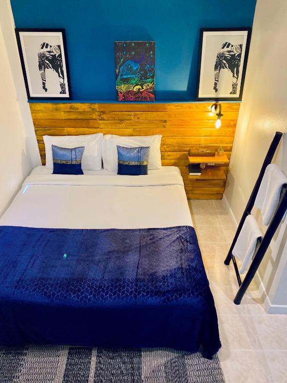 Postel nebo postele na pokoji v ubytování BH Baan Paradise Hotel Patong