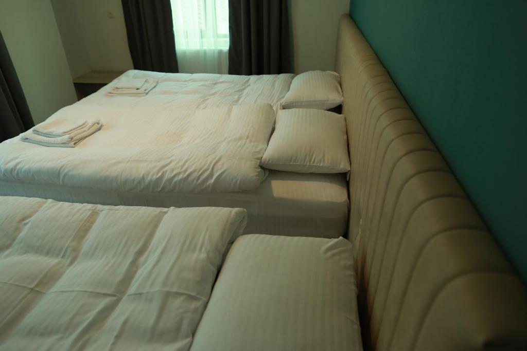 A bed or beds in a room at Paramount Kazbegi