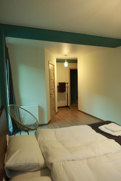 A bed or beds in a room at Paramount Kazbegi