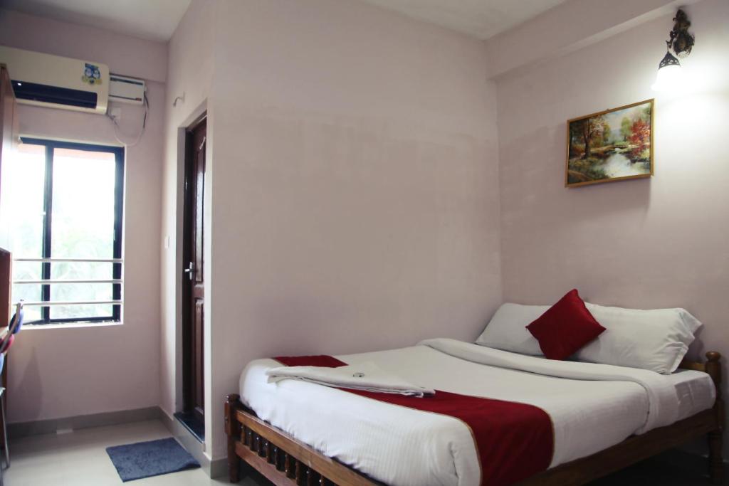 Postel nebo postele na pokoji v ubytování Hotel Tri-Star Regency