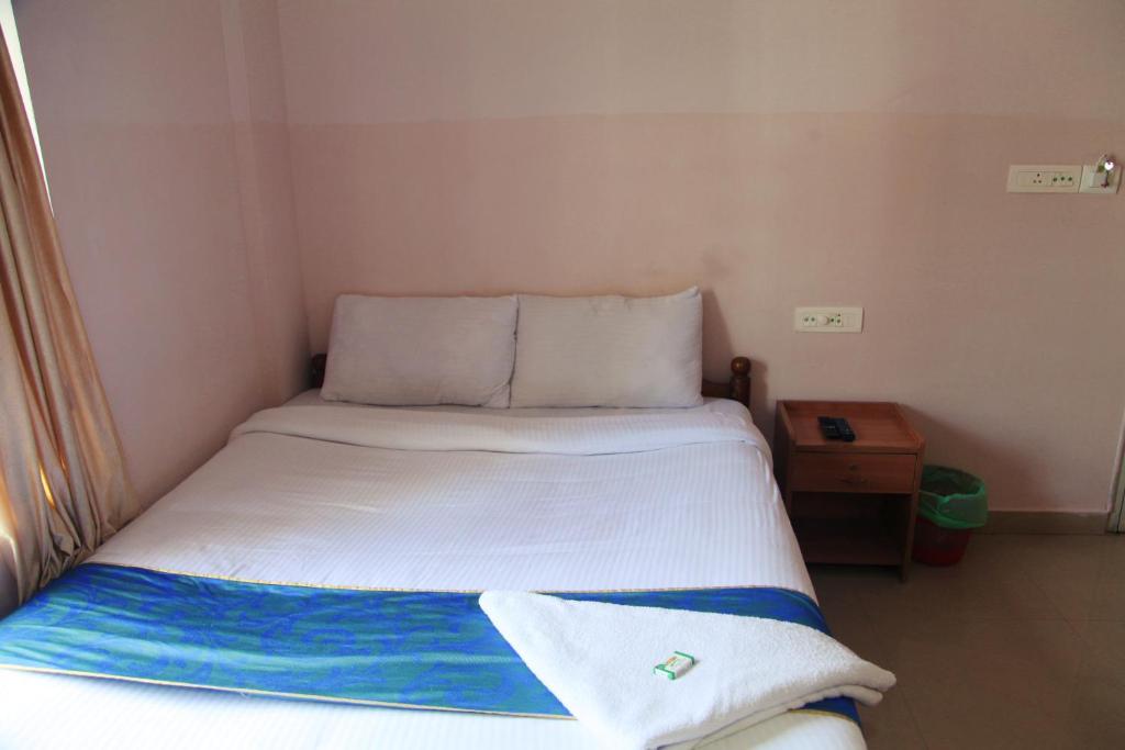 Postel nebo postele na pokoji v ubytování Hotel Tri-Star Regency