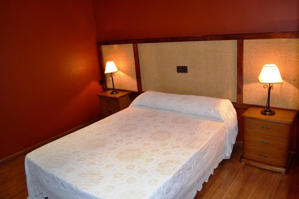 Posteľ alebo postele v izbe v ubytovaní Hostal Pension La Ruta