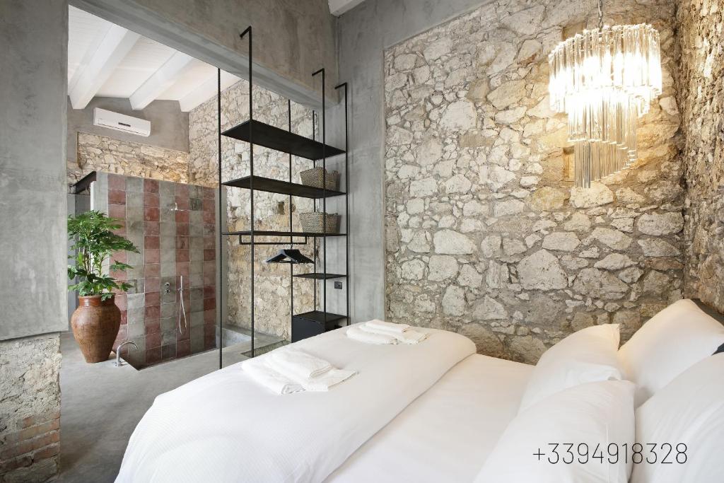 Postel nebo postele na pokoji v ubytování ISONZO SUITES
