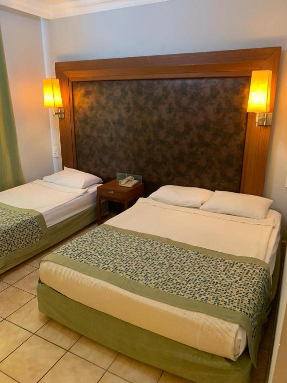 A bed or beds in a room at More Hotel