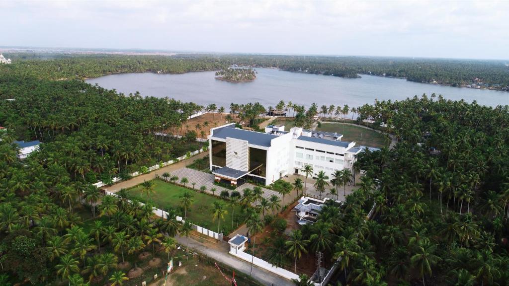 an aerial view of a building next to a river at Blue Serene Resort in Trichūr