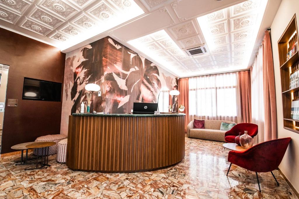 TV a/nebo společenská místnost v ubytování Hotel Souvenir