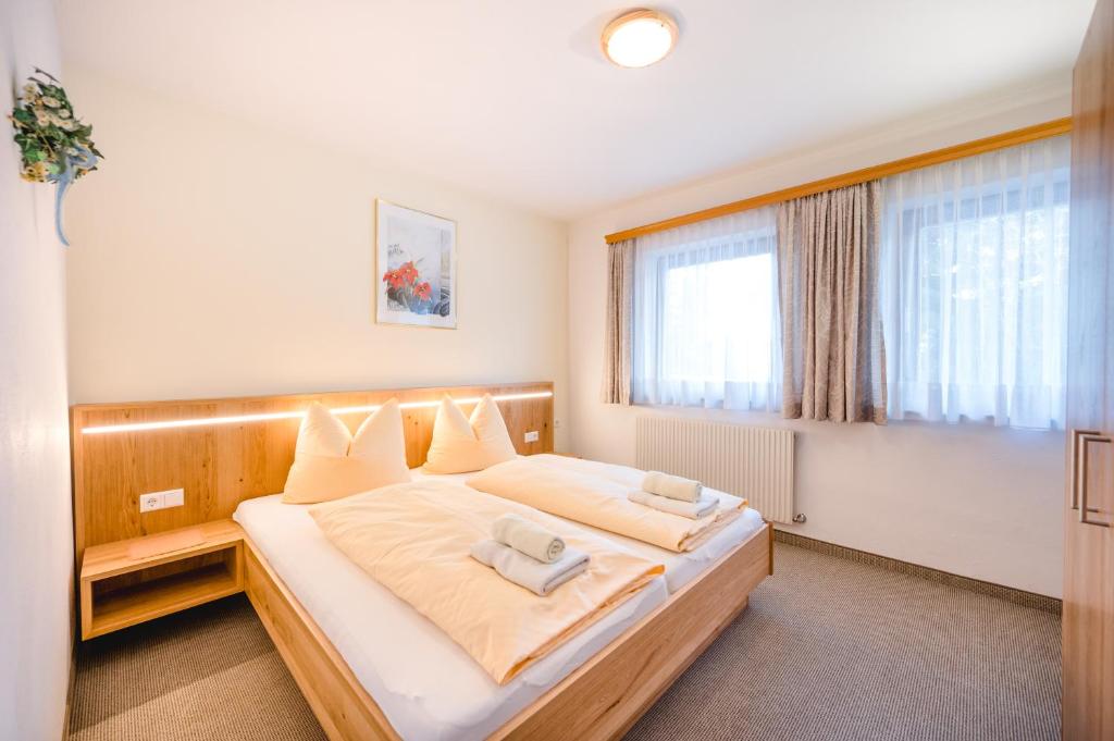 Posteľ alebo postele v izbe v ubytovaní Apartmenthaus Kuchelberg