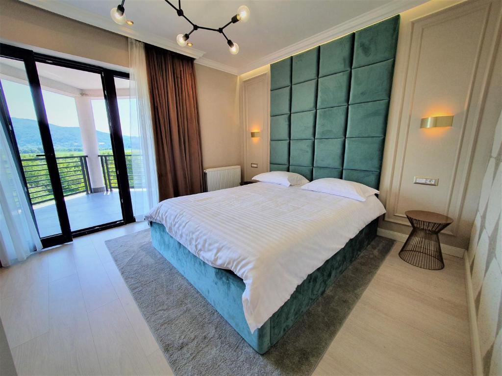 מיטה או מיטות בחדר ב-Casa Campeanu