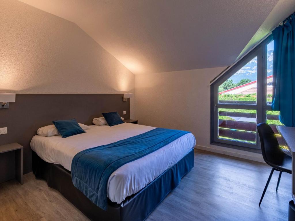 Katil atau katil-katil dalam bilik di Noemys Viviers-du-lac