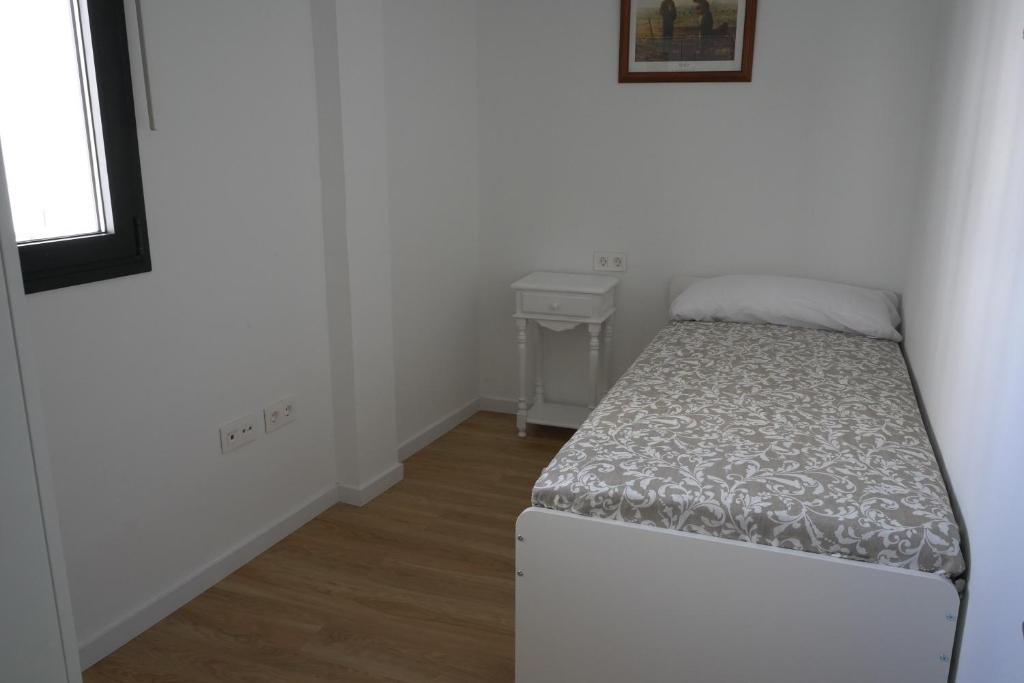 Posteľ alebo postele v izbe v ubytovaní Almona de Triana - Kainga Homes
