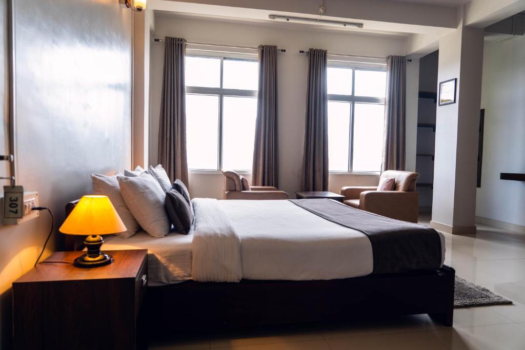 Uma cama ou camas num quarto em Hotel Ariel