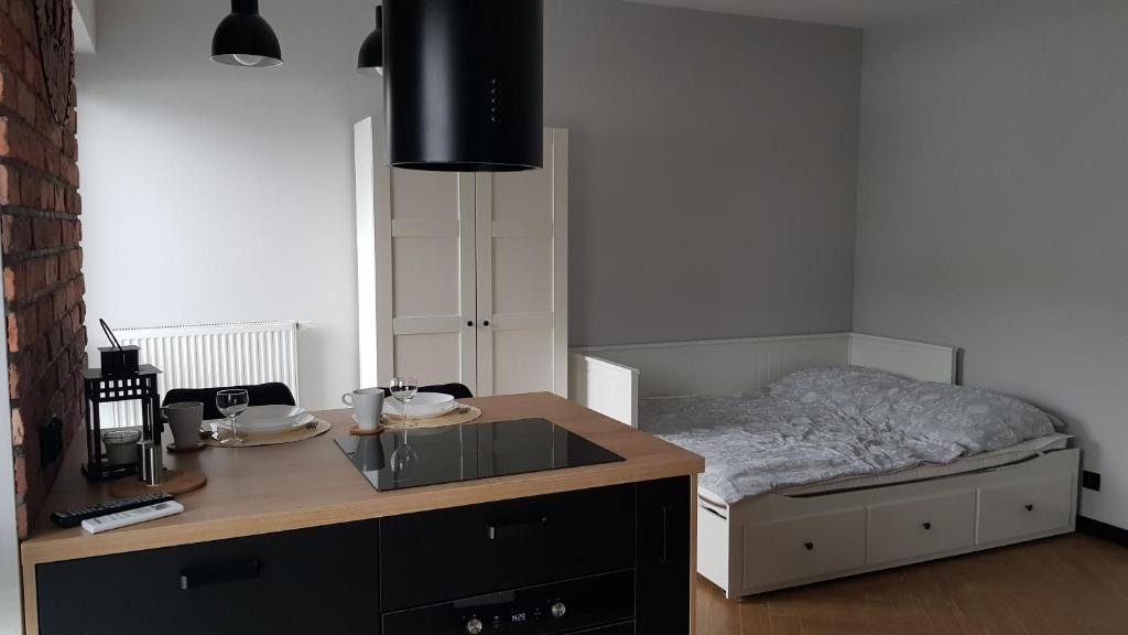 Posteľ alebo postele v izbe v ubytovaní Apartament Zamkowy