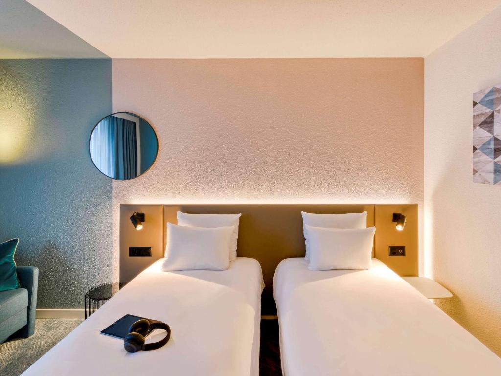 Postel nebo postele na pokoji v ubytování Novotel Zurich City West