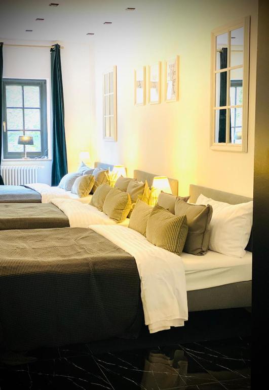 Postel nebo postele na pokoji v ubytování Sleephotels Suite Garde