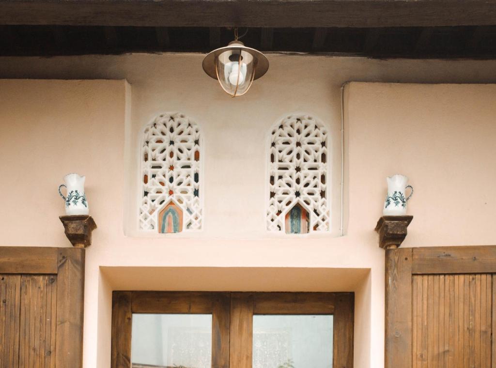 a building with two windows and a door at Fery & Nico in Granada